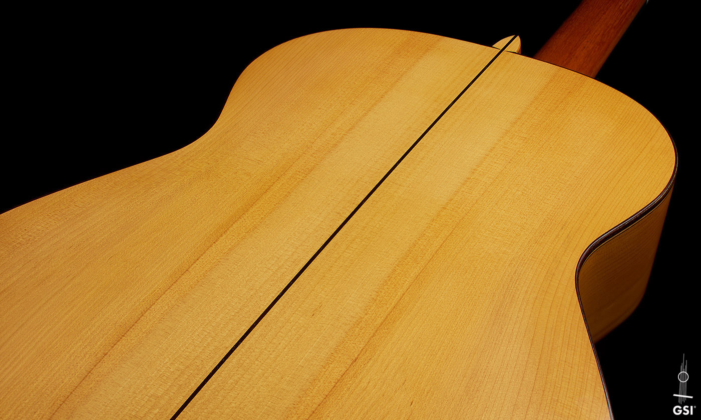 The back center seam of a 1999 Jose Marin Plazuelo flamenco guitar made of spruce and cypress