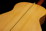 The back center seam of a 1999 Jose Marin Plazuelo flamenco guitar made of spruce and cypress