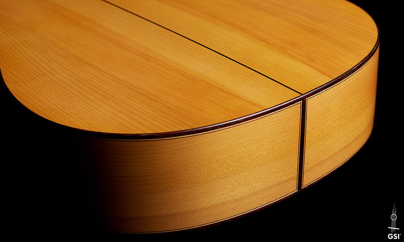 The sides at the foot of a 1999 Jose Marin Plazuelo flamenco guitar made of spruce and cypress