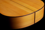 The sides at the foot of a 1999 Jose Marin Plazuelo flamenco guitar made of spruce and cypress