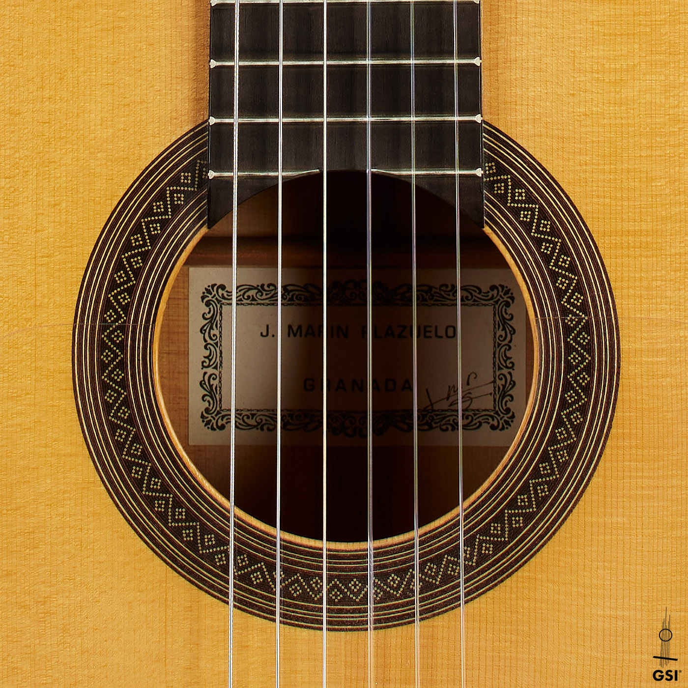 The rosette of a 1999 Jose Marin Plazuelo flamenco guitar made of spruce and cypress