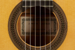 The rosette of a 1999 Jose Marin Plazuelo flamenco guitar made of spruce and cypress